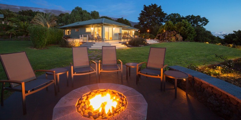 Lit fire pit at night 